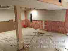 basement construction showing drywall intalled over insulated framed walls
