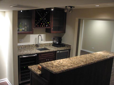 Finished basement bar with sink and wine rack