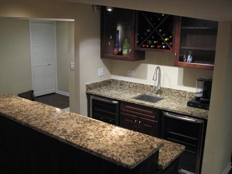 Custom built-in wet bar with Cherrywood cabinets and granite bar tops