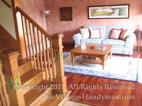 Oak stairway conversion in Naperville featuring Newell posts with inlaid antique tiles
